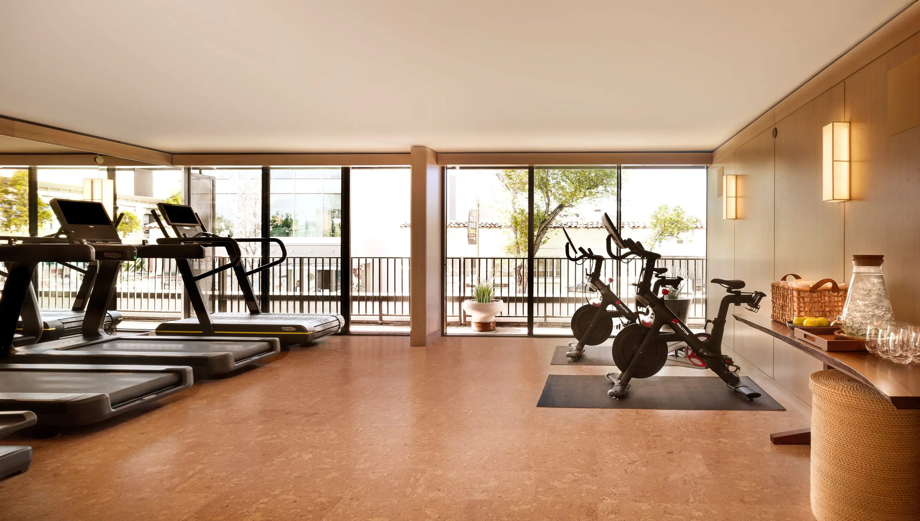 Bright gym with treadmills and stationary bikes