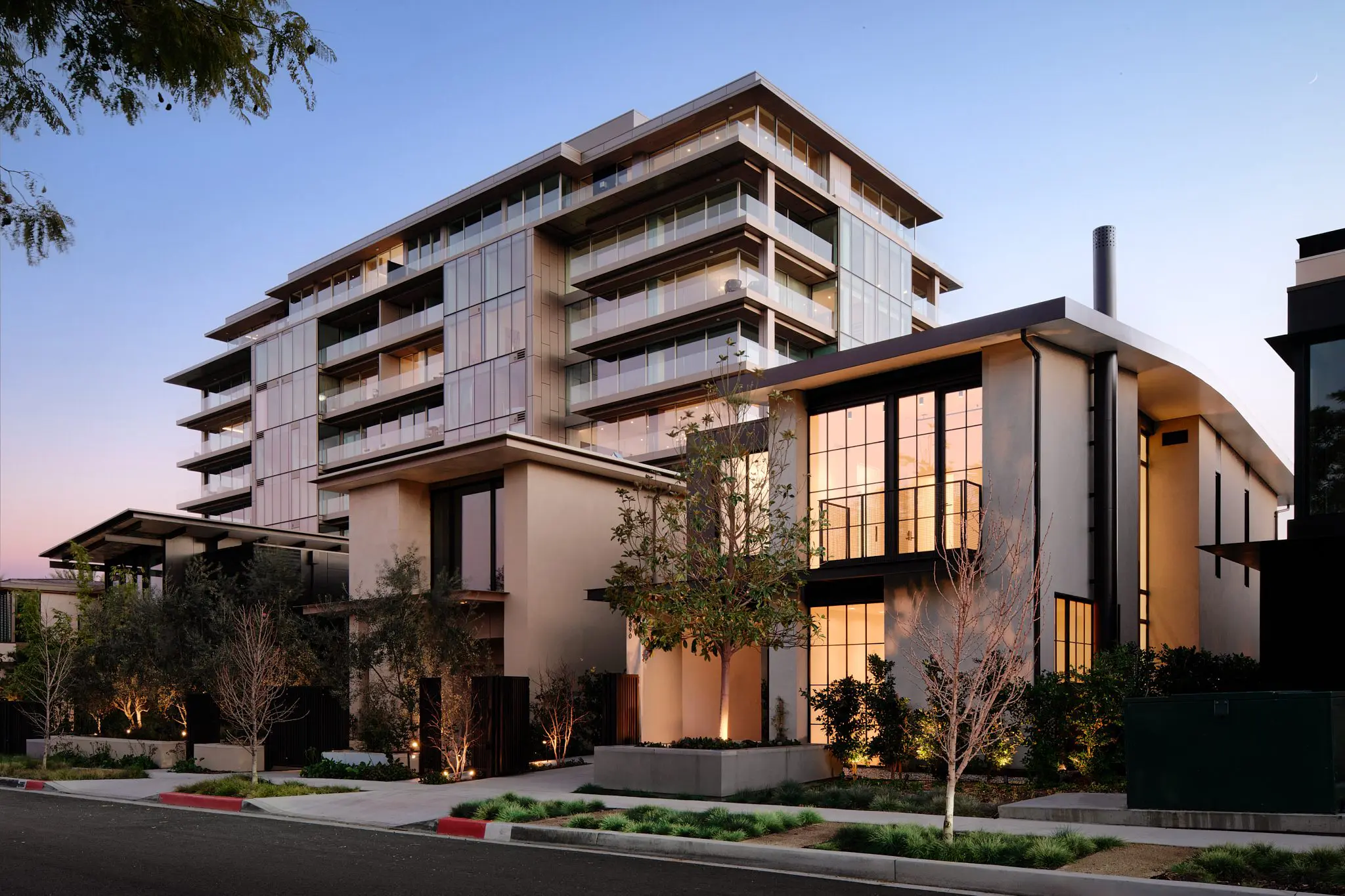 Modern luxury apartment building at dusk