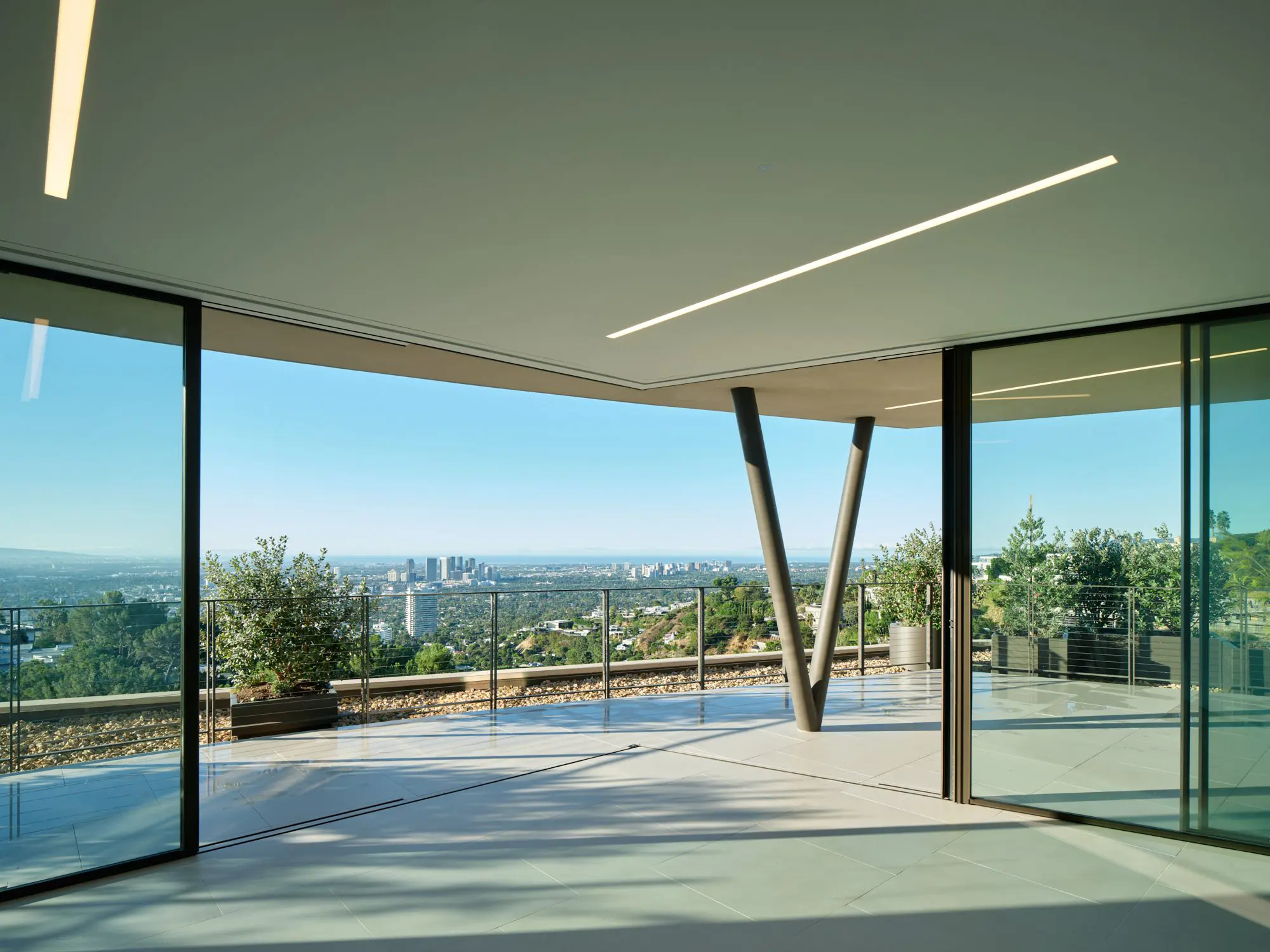 Modern glass terrace with panoramic city skyline view