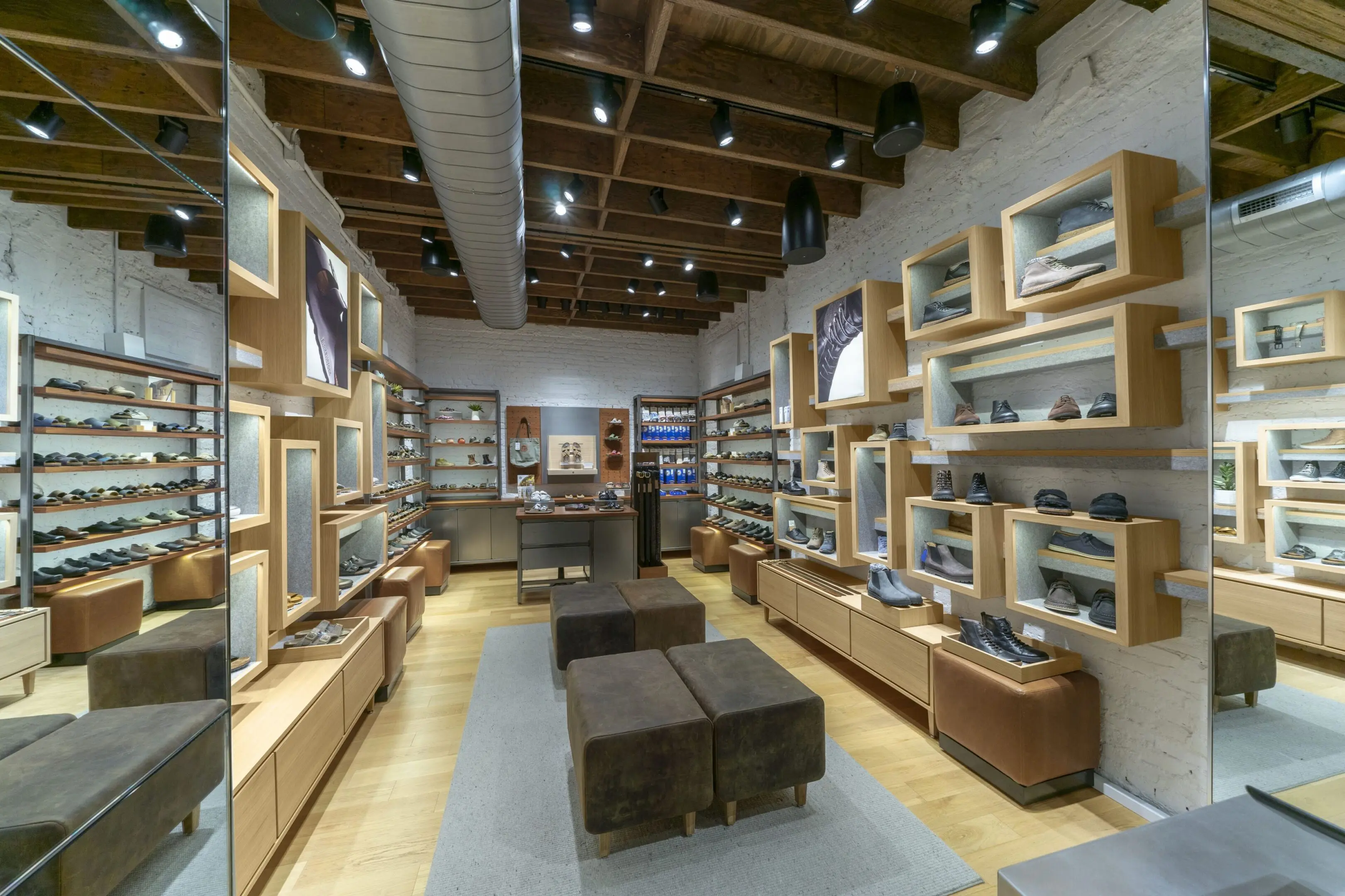 Shoe boutique interior with shelves and seating